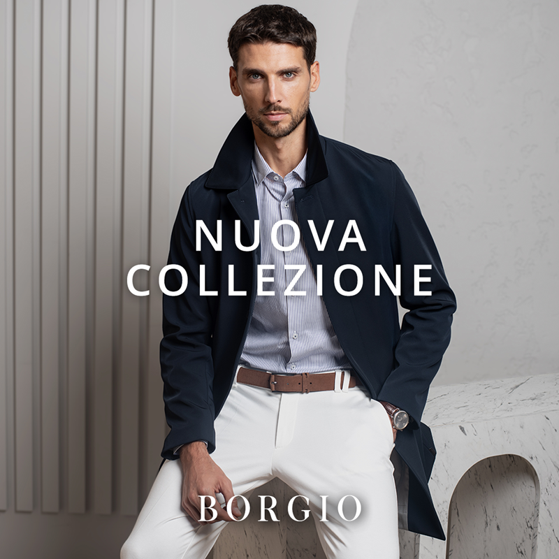 Mężczyzna w eleganckim płaszczu i białych spodniach – Nuova Collezione BORGIO